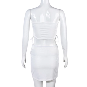 Detailed back view of white ribbed knit two-piece set featuring adjustable side drawstrings