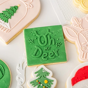 Christmas reindeer and tree fondant cookie cutters with embossed festive patterns