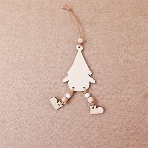 Top view of wooden Christmas gnome ornament with twine rope on burlap background