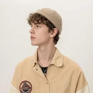 Khaki washed cotton Miki hat paired with a corduroy jacket and 1988 embroidery