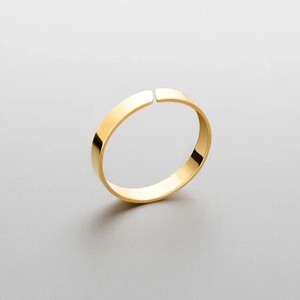 Polished gold flat open bangle made of high-quality titanium steel for a minimalist look
