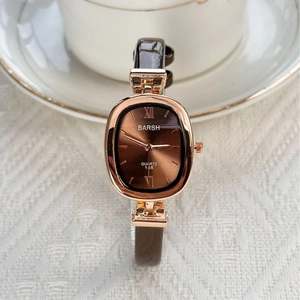 Elegant oval quartz watch with brown leather strap and rose gold minimalist case