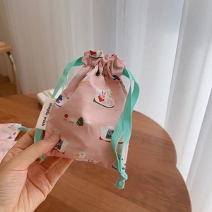Pink cotton drawstring bag with cute duck prints for storage and small accessories