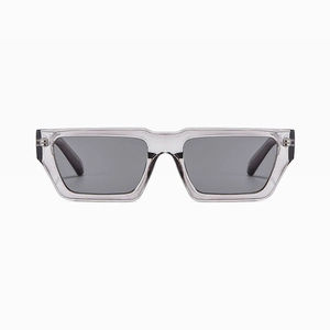 Front detail of rectangular gray translucent sunglasses with dark tinted lenses