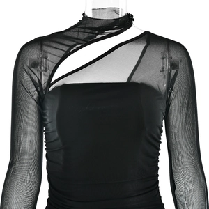 Detailed view of black sheer mesh long sleeve top featuring asymmetric cut-outs and ruching