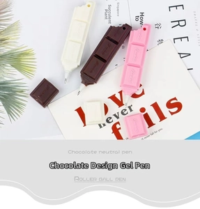 Detail showing chocolate-shaped ballpoint pens in three colors with realistic texture