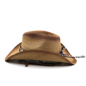 Detail of bohemian western straw hat showing gradient weave and ethnic braided band