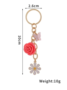 Detail view of 10cm floral keychain showing dimensions, weight, rose and daisy pendants