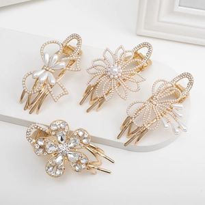 Set of four gold metal flower and bow hair clips with pearls and rhinestones on a white stand