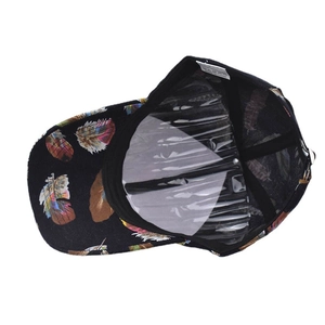 Detail view of cotton baseball cap interior featuring feather print and inner care label