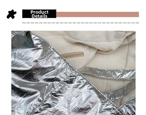 Detailed close-up of metallic silver nylon fabric and internal zipper pocket lining