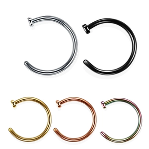 Macro detail of C-shaped nose rings in five metallic colors on a white background