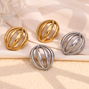 Modern 18K gold and silver plated hollow dome stud earrings on elegant silk background