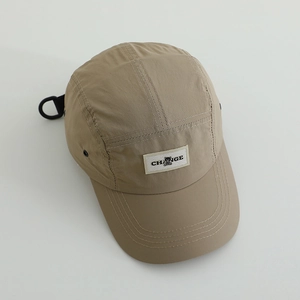 Quick-dry khaki camper hat with CHANGE text and bear patch, featuring breathable metal eyelets
