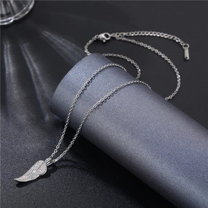 Detailed view of leaf pendant with micro-paved cubic zirconia and lobster clasp