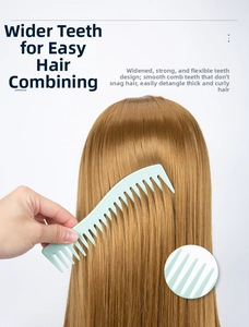 Detail of wide tooth hair comb in light green detangling long hair with smooth rounded tips