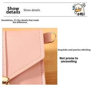 Close-up of pink leather phone bag showing precise stitching and golden D-ring hardware