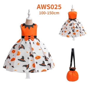 Detail of girls pumpkin witch Halloween costume dress with matching pumpkin bag for kids