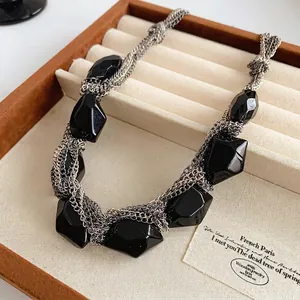 Statement layered silver chain necklace with oversized faceted black irregular pendants