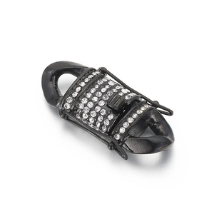 Detail of black stainless steel dragon head clasp with sparkling crystal rhinestones