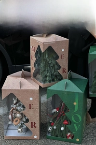 Christmas tree gift box with tree-shaped window, holiday decor, and festive greetings