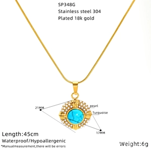 Gold stainless steel necklace featuring a turquoise and pearl pendant on white background