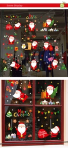 Detail showing Santa Claus and snowy house static cling stickers on a glass window