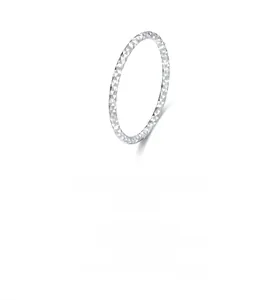 Detail of S925 sterling silver ring with shimmering diamond-cut textured surface