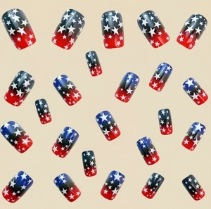 Detailed view of American flag press-on nails with blue stars and red gradient effect