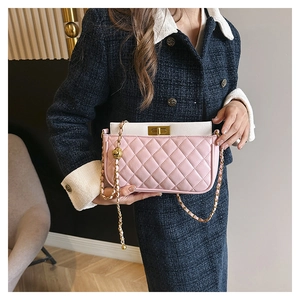 Detailed view of pink and white quilted PU leather crossbody bag with gold ball chain