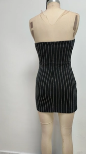 Detail of back view zipper and vertical silver rhinestone stripes on black mini dress