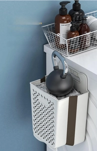 Strong load-bearing foldable laundry basket mounted on cabinet showing heavy weight capacity