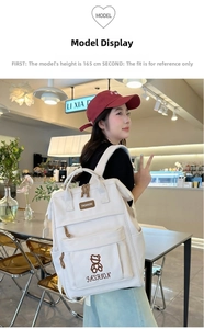 Beige student backpack with embroidered bear and fashion text shown on a 165cm model