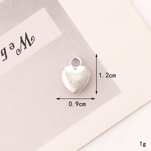 Detail view of heart-shaped zinc alloy pendant with 1.2cm height and 0.9cm width measurements