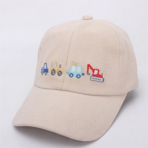 Close-up of beige kids baseball cap with colorful cartoon vehicle embroidery details