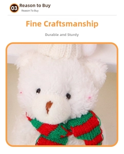 Close-up of white plush bear wearing a red-green knit scarf and a white winter hat