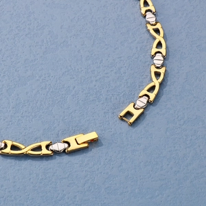 Two-tone gold and silver stainless steel necklace and bracelet set close-up view