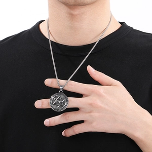 Silver Eye of Providence pendant necklace on male model with black t-shirt