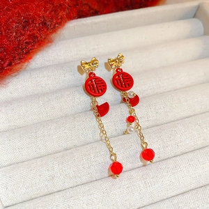 Elegant Chinese New Year earrings with gold Fu character charms and red silk tassels
