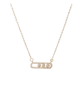Close-up of golden geometric pendant with three sliding zircons and pavé setting