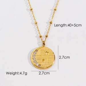 Detail of 14K gold plated necklace showing crescent moon pendant with rhinestones