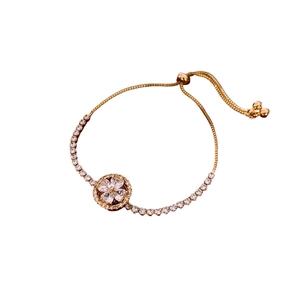 Golden clover zircon rotating bracelet with adjustable slider clasp and sparkling crystals