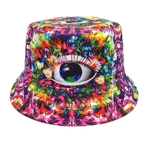 Close-up of vibrant bucket hat featuring a psychedelic eye graphic and floral patterns