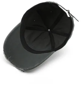 Detailed interior view of a dark grey washed cotton baseball cap with worn edges