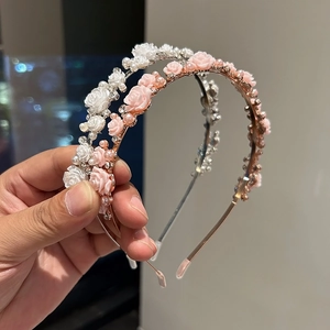 Elegant floral headbands with rose charms and pearls in silver and gold finishes