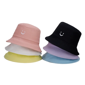Close-up of children's smiley face bucket hats in six vibrant colors for summer