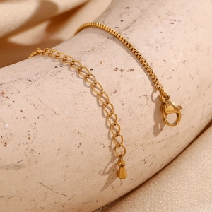 Detail of 18K gold plated stainless steel box chain anklet with lobster clasp and extender