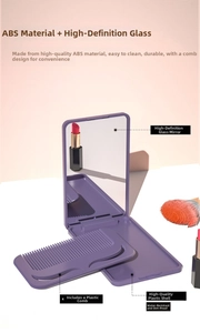 Detail view of purple foldable makeup mirror and mini comb on a stylish pink tabletop