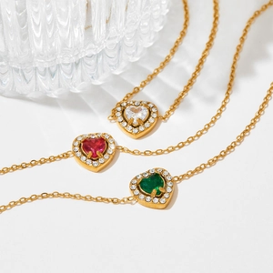 Elegant gold heart pendant necklaces with vibrant red, green, and white zircon gemstones