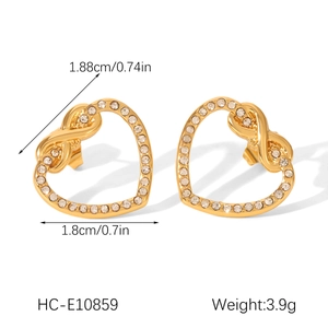 Detailed view of gold heart stud earrings with rhinestones showing size and weight specs